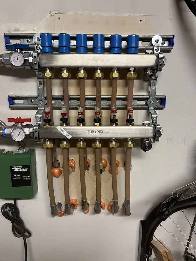 Plumber performing Water Heater Repair at a residential property in Algoma